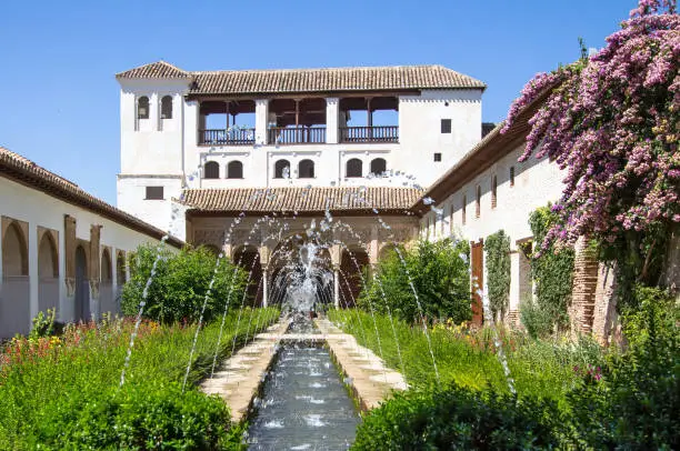 Garden and fountain in patio de la Acequia La Alhambra, Granada, Andalucia, Spain