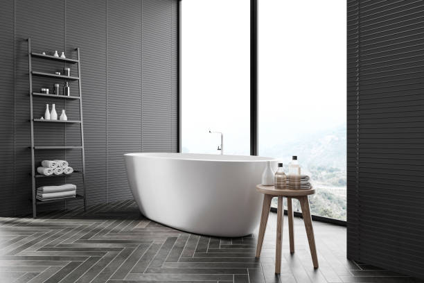 istock Dark gray bathroom corner with tub and shelves 1219686369