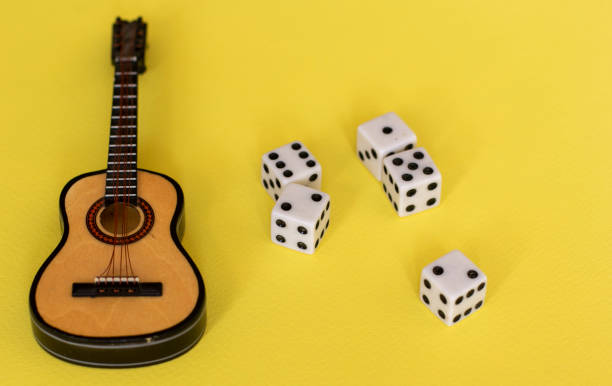 istock Guitar musical instrument on a yellow background 1219688100