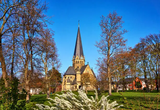 Spring flowers in front of the St. Petri church in Thale. Saxony-Anhalt, Harz, Germany