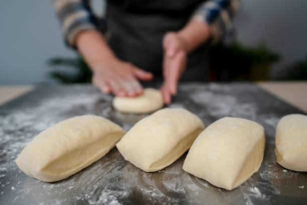 istock artisanal wholegrain bread:  kneading and shaping 1219688977