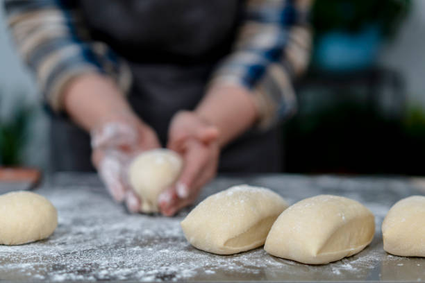istock artisanal wholegrain bread:  kneading and shaping 1219688988