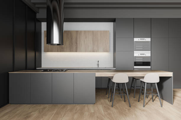 istock Gray and wooden kitchen interior with bar 1219689092