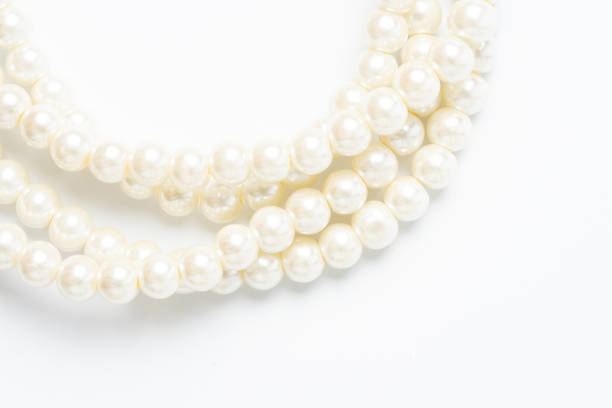 istock pearl necklace isolated on white blackground 1219689212