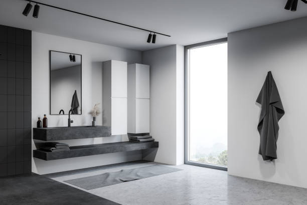 istock Loft white bathroom corner with sink and cabinets 1219689956
