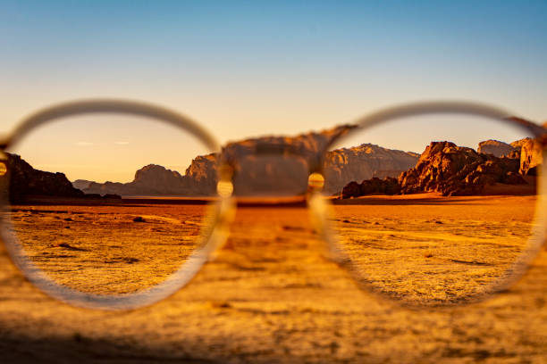 istock View at the Wadi Rum desert in Jordan through glasses during a nice sunset with clear sky. 1219690077
