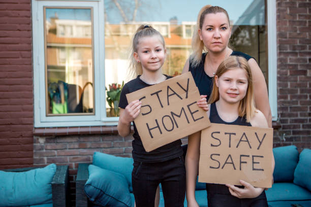 istock A beautiful mother and two young daughters at home during the lockdown 1219690173