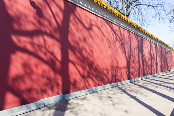 istock Red walls and shadows of trees 1219690277