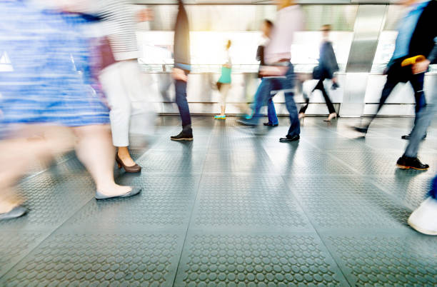istock Blurred people walking in a corridor 1219690382