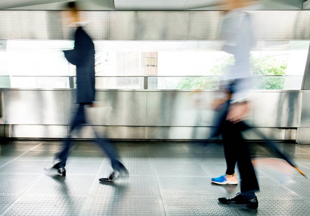 istock Businessman walking on city footbridge 1219690498