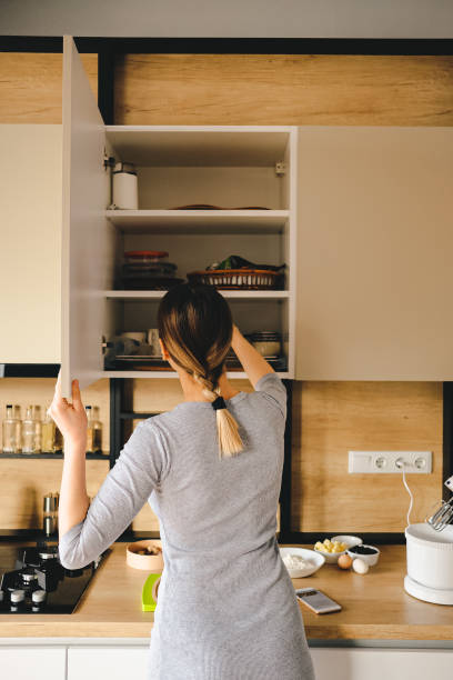 istock Woman home taking something from a kitchen store 1219691231