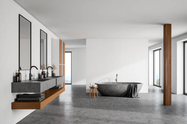 istock White bathroom interior with stone tub and sink 1219692115