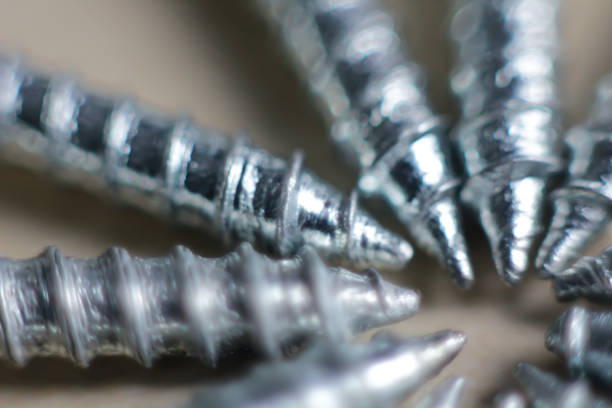 A close up shot of a few silver screw threads and point