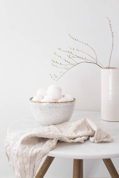 istock Rustic bowl of raw chicken eggs. Easter minimalism concept 1219695543