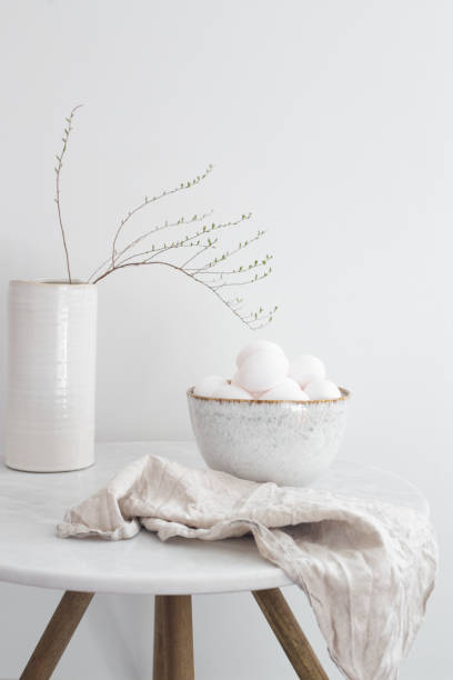 istock Rustic bowl of raw chicken eggs. Easter minimalism concept 1219695568
