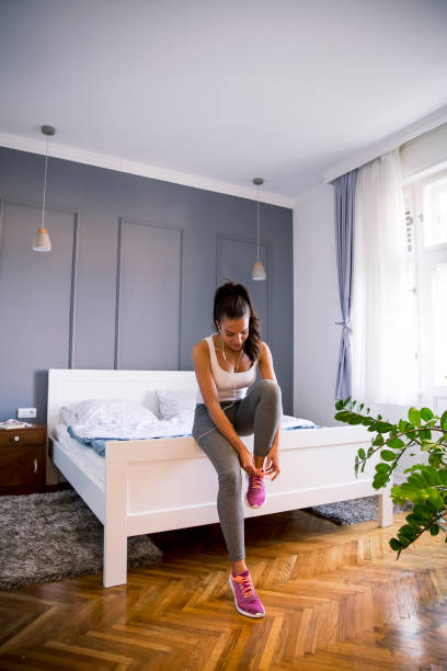 istock Young attractive woman preparing for exercises at home 1219695861