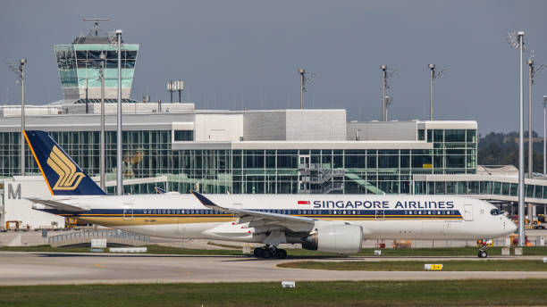 Airbus A350 Singapore Airlines takes off from Munich Airport Munich, Germany - September 15, 2019: An Airbus A350-941 from Singapore Arlines takes off from Munich Airport in the afternoon. The aircraft with registration 9V-SMH had its first flight in November 2016 and has been in use for Singapore Airlines since then. munich airport stock pictures, royalty-free photos & images