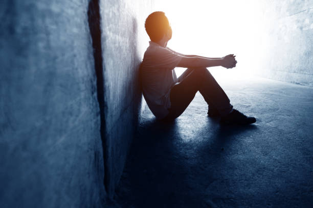 istock Desperate man sitting in the tunnel 1219699316