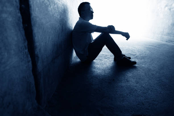 istock Desperate man sitting in the tunnel 1219699318
