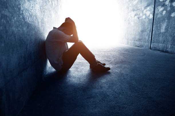 istock Desperate man sitting in the tunnel 1219699437