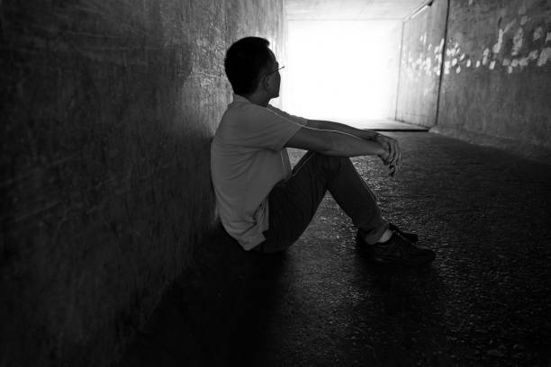 istock Desperate man sitting in the tunnel 1219699584