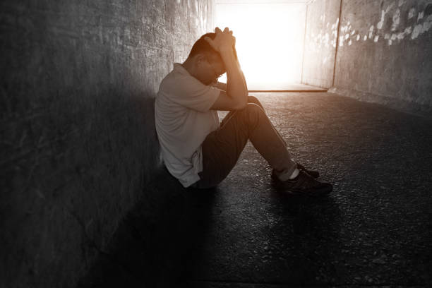 istock Desperate man sitting in the tunnel 1219699592