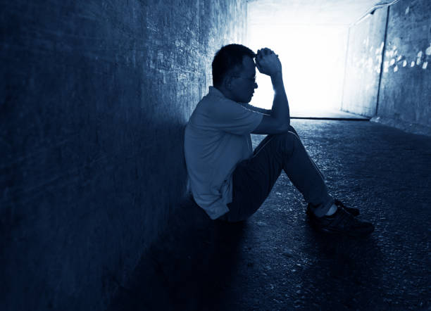 istock Desperate man sitting in the tunnel 1219699703