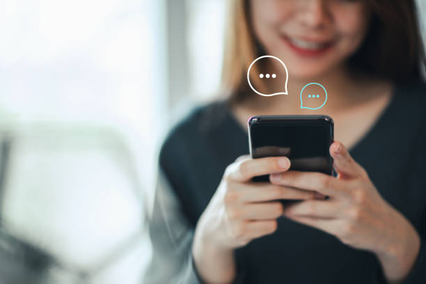 istock Women's hand typing on mobile smartphone, Live Chat Chatting on application Communication Digital Web and social network Concept. 1219700578