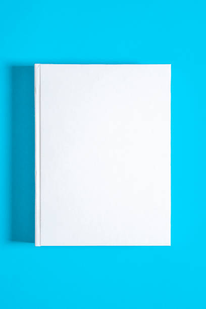 istock Mockup of closed blank square book at white textured paper 1219701718