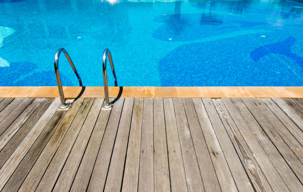 istock Swimming pool with metal ladder 1219701965