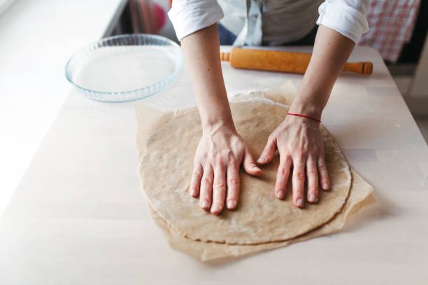 istock A young woman preparing a cake. 1219703109