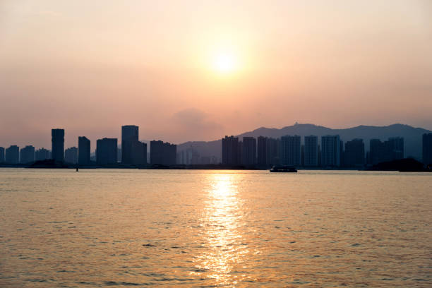 istock City by the sea in sunset 1219703164