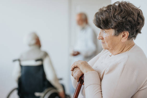 istock Woman with walking stick 1219703839
