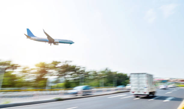 istock Plane flying over the city highway 1219704054