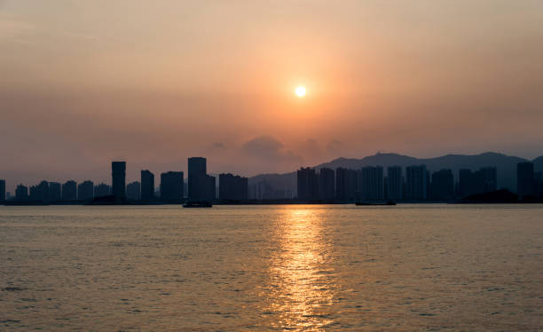 istock City by the sea in sunset 1219704270