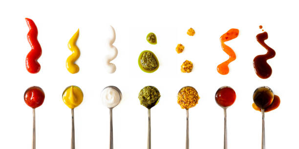 Ketchup, mustard, mayonnaise, basil pesto, sweet chili sauce and teriyaki soy sauce in spoon isolated on white background, top view. Various seasoning and dip border horizontal banner format Ketchup, mustard, mayonnaise, basil pesto, sweet chili sauce and teriyaki soy sauce in spoon isolated on white background, top view. Various seasoning and dip border horizontal banner format savory sauce stock pictures, royalty-free photos & images