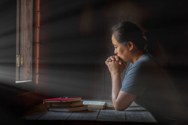 istock Woman praying in the morning. 1219705585