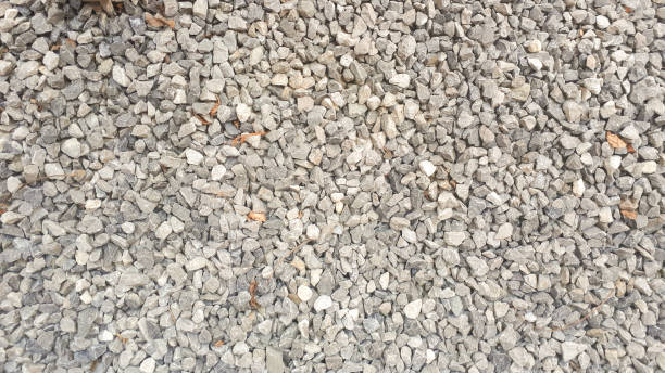 istock stone background, dark gravel pebbles stone texture 1219706341