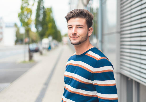 istock Portrait of young casual friendly man, selective focus 1219706375