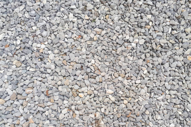 istock stone background, dark gravel pebbles stone texture 1219706413