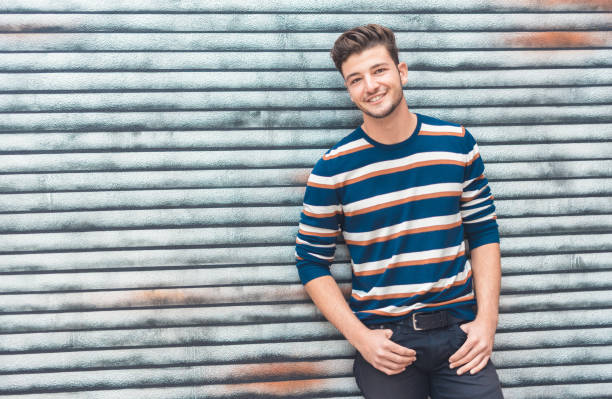 istock Happy young man with positive face expression lookig to side 1219706654