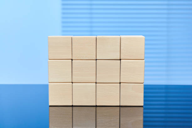 istock Wooden cubes on a blue background 1219710934