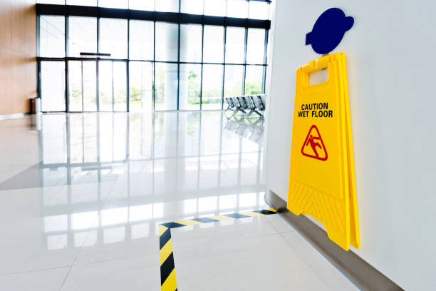 istock Wet floor sign hanging on the wall 1219712095