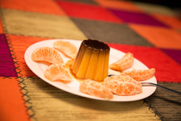istock home made caramel custard or flan with tangerine slices on multicolored tablecloth 1219712248