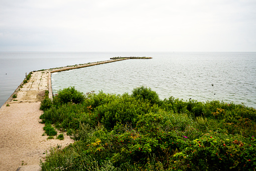 Vente Cape in Lithuania. View of a pier in the sea.