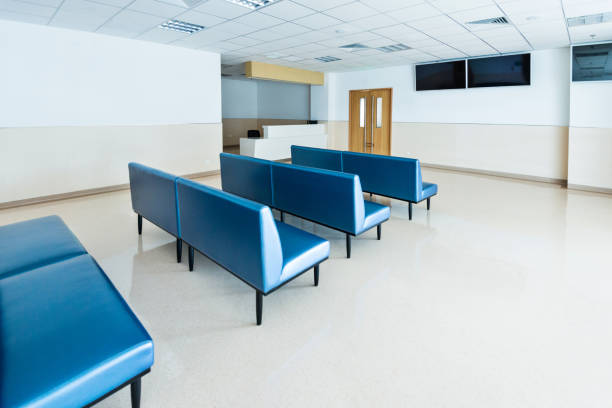 istock Blue bench in hospital waiting room 1219712606