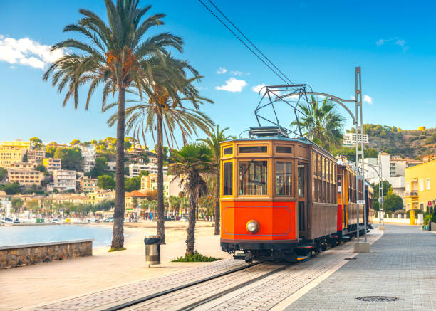 The famous orange tram runs from Soller to Port de Soller, Mallorca, Spain stock photo