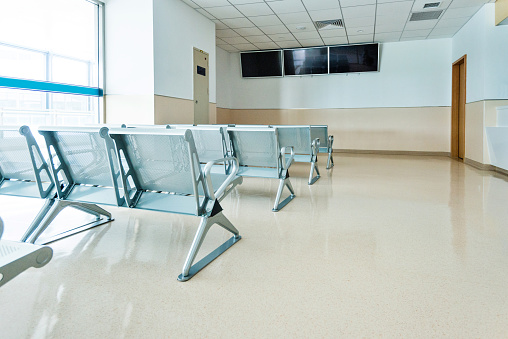 Empty seats in hospital waiting room.