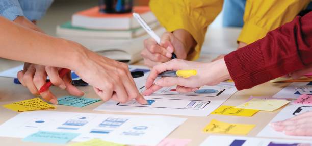 istock Brainstorm planing creative asian teamwork,  Close up of hands mobile phone app developer team meeting for share ideas about screen display prototype layout for smartphone, ui, ux startup small business 1219714161
