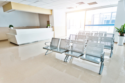 Empty seats in hospital waiting room.